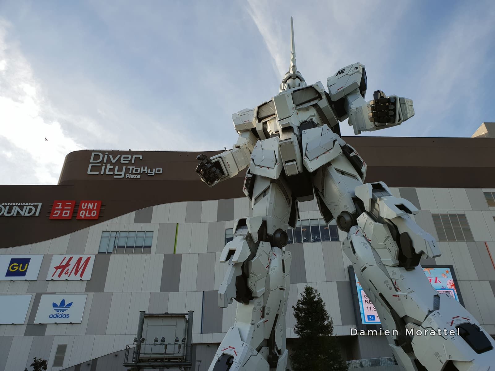 The giant Gundam robot statue in front of a shopping mall