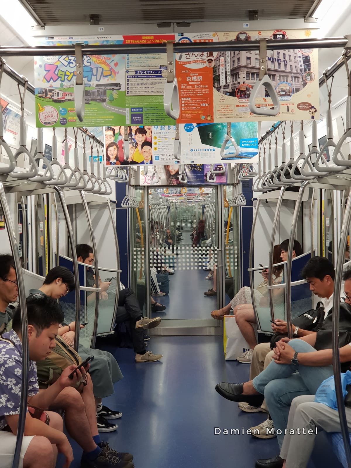 Passengers asleep in a subway car
