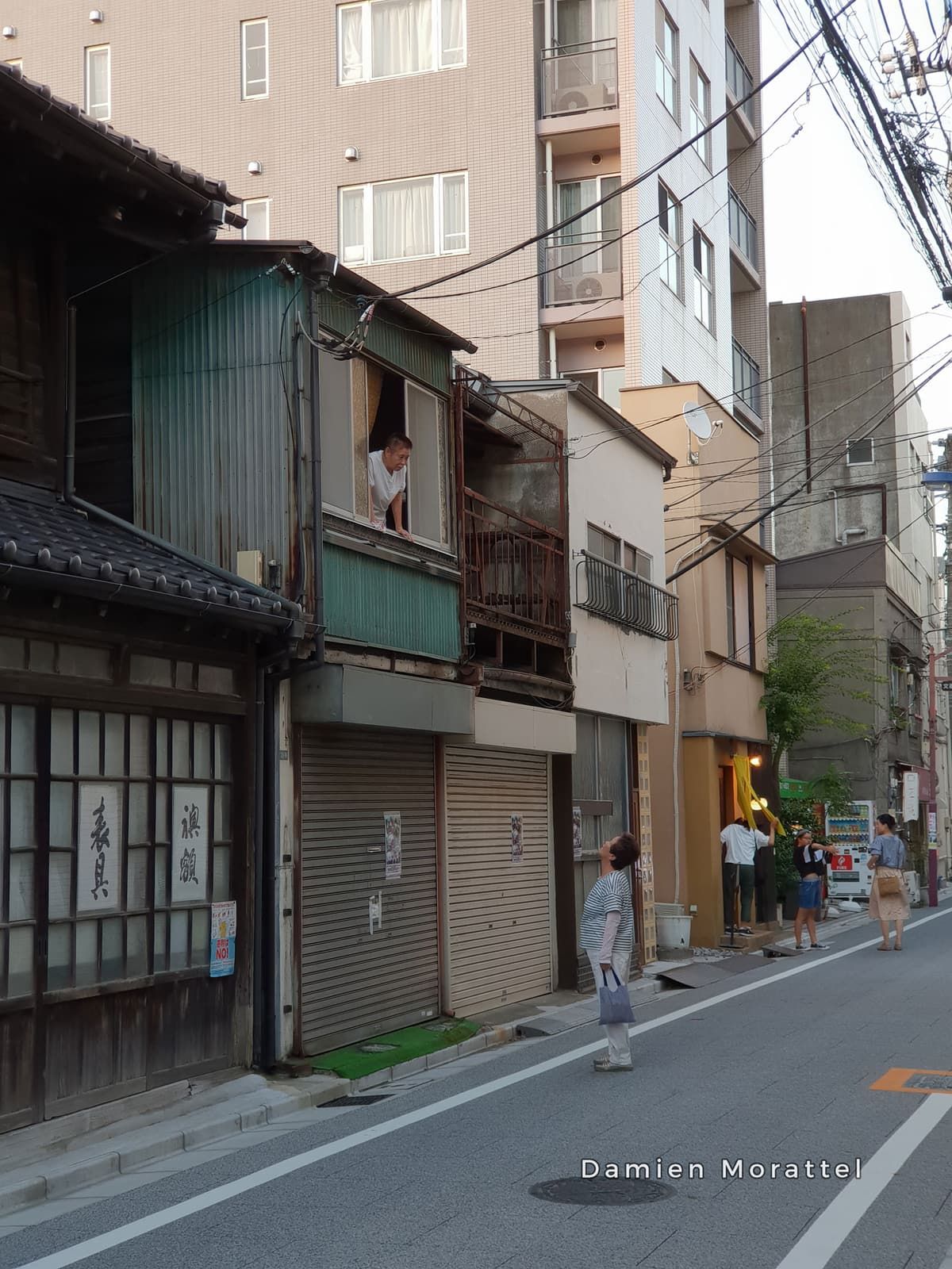 A narrow street lined with old houses