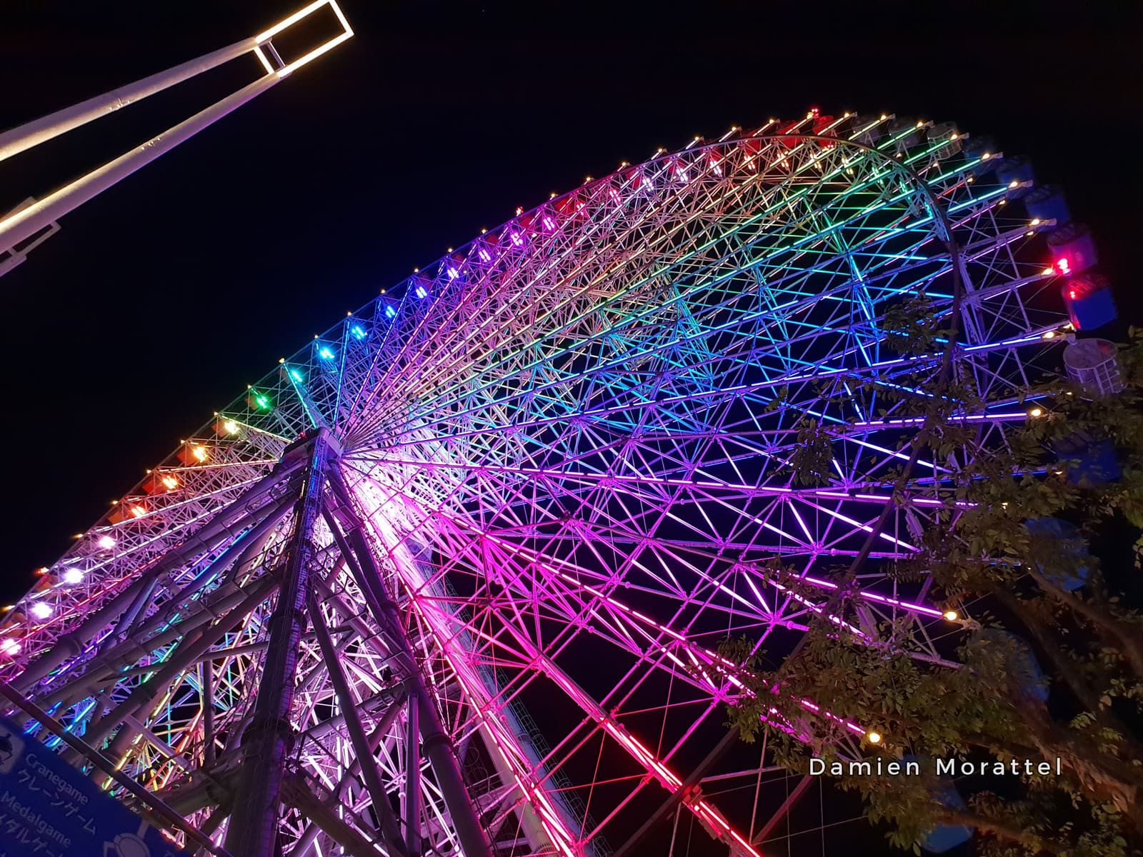 An illuminated Ferris wheel at night