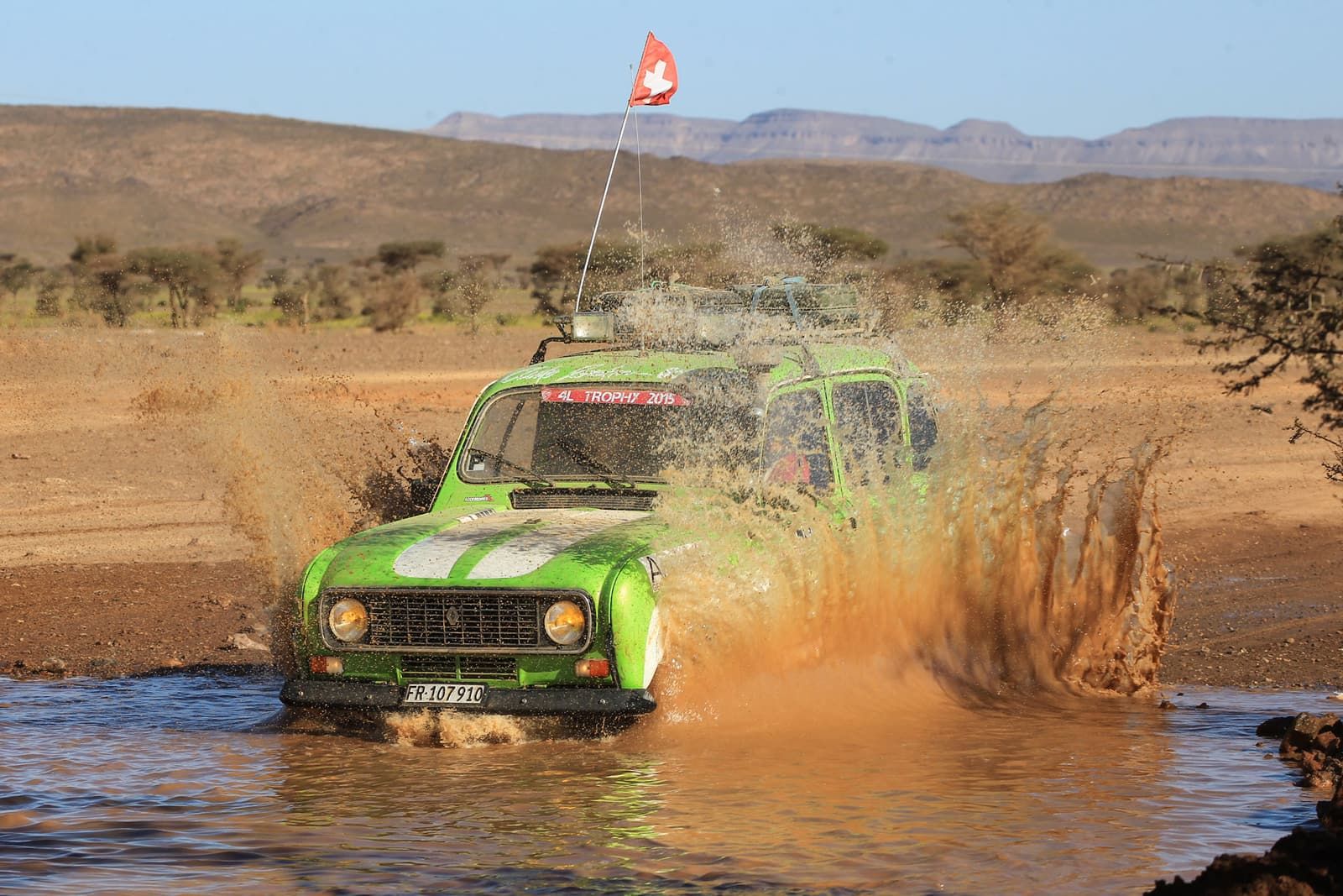 The Renault 4 splashing through a ford