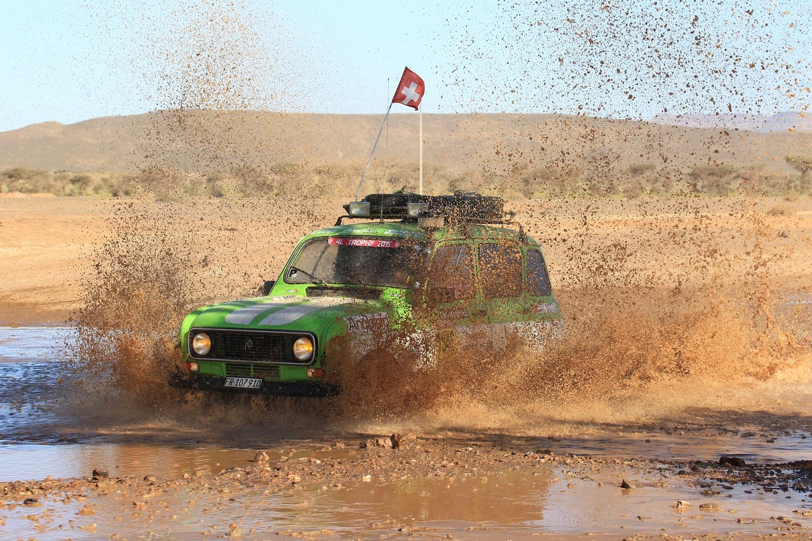 The Renault 4 in a spray of mud