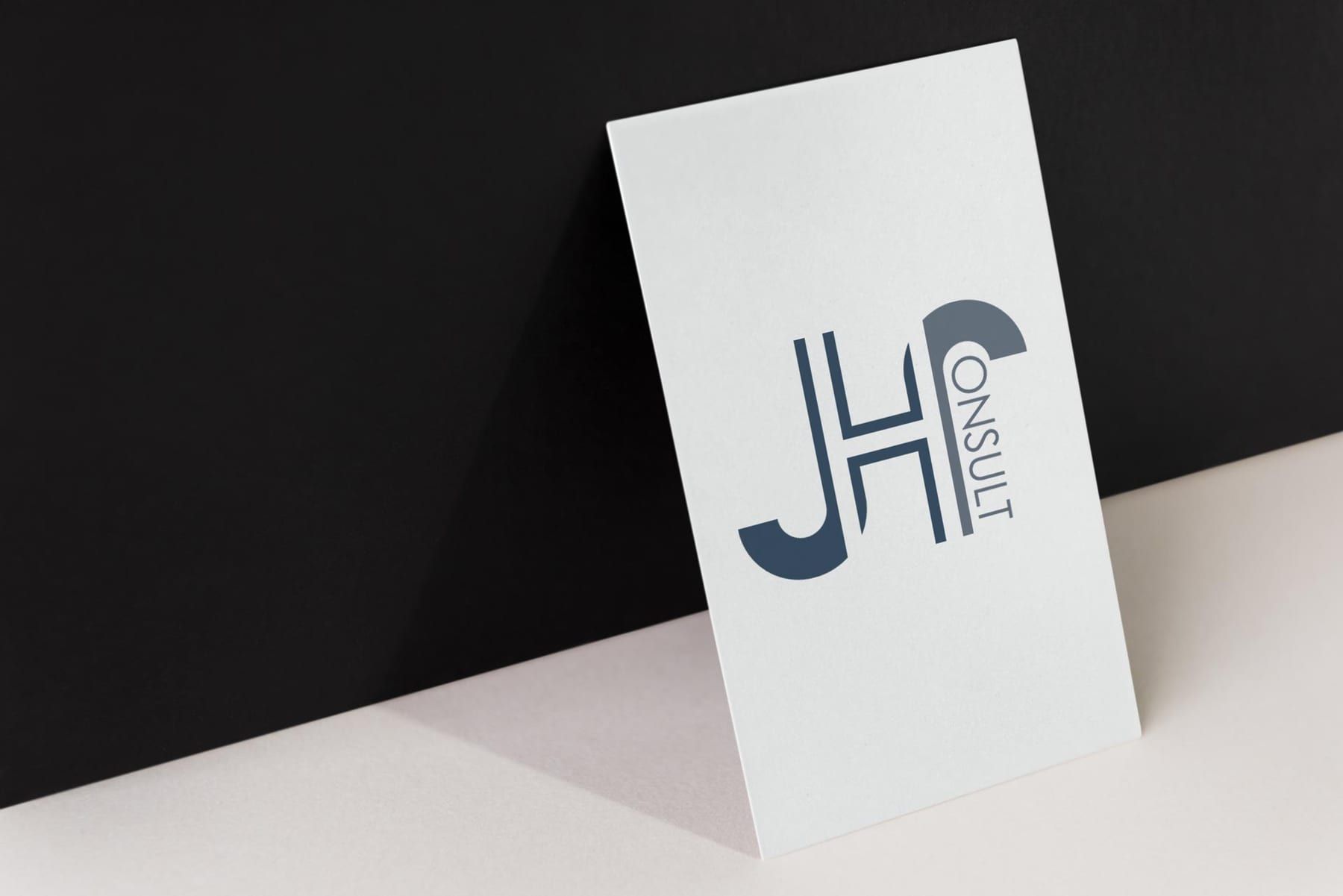 Une carte de visite portant le logo JH Consult